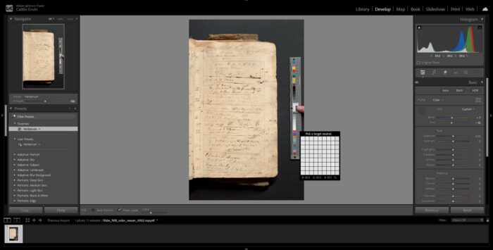 A photo‑editing software screen displaying a ledger page. A color calibration chart are placed beside the ledger for reference.
